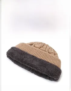 Close-up of winter knit hat featuring thick faux fur lining and warm thermal texture