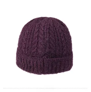 Detailed back view of a dark purple knitted beanie with thick cable patterns and warm lining