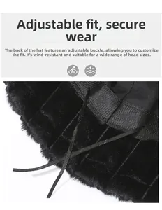 Adjustable drawstring detail inside a black faux fur bucket hat for a secure windproof fit