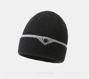 Detailed close-up of winter knit beanie with soft lining and decorative gray triangle patch