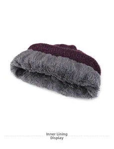 Detail view of the thick gray fleece lining and purple knit texture for winter warmth