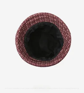 Detail view of the warm winter bucket hat's black fabric lining and grid pattern