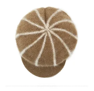 Close-up of brown winter knit hat featuring white radial stripes and soft fuzzy texture