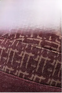 Detailed close-up of warm winter floral print hat for elderly women with soft fleece lining