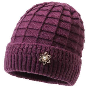 Detail of purple winter knit beanie with thick fleece lining and floral metal brooch