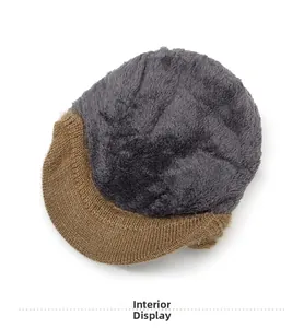 Detail of winter knit hat featuring thick brown knit exterior and soft plush lining
