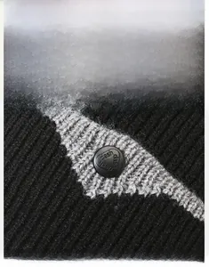 Detailed macro view of rib-knitted beanie fabric and decorative black dash button