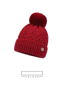 Winter jacquard knit beanie for women with fur pompom and rhinestone H emblem in red
