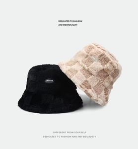 Thick checkered and solid black plush bucket hats with embroidered IMMUNE patch for women
