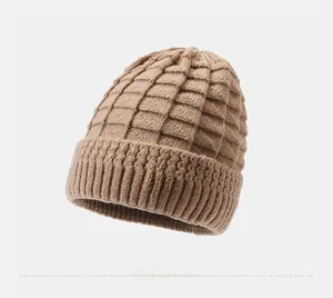 Detail of light coffee knit hat featuring textured square weave and pearl flower accent