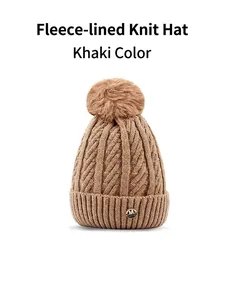 Detailed macro view of khaki knit beanie featuring soft fleece lining and golden M logo