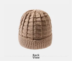 Back view of a thick brown knit hat with textured grid pattern and ribbed edge for winter