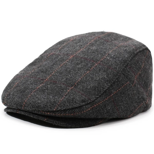Detail of grey herringbone wool fabric with red windowpane check on a flat cap