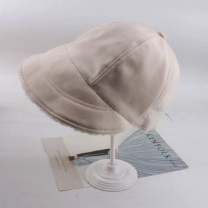 Detail of winter fleece-lined bucket hat in beige corduroy with thick faux wool lining