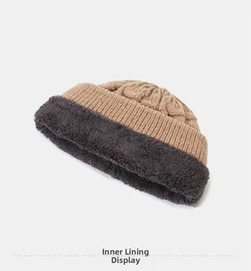 Detailed interior view of winter knit hat with thick warm grey fleece lining texture