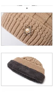Detailed view of winter knit hat featuring warm fleece lining and floral pearl buckle