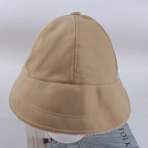 Detail of khaki twill bucket hat with plush lining and top button on a display stand