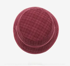 Top view of red plaid bucket hat for women showing round crown and detailed stitching