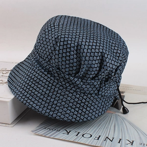 Women's plaid bucket hat in navy blue with subtle glitter finish and adjustable cord