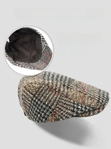 Detail view of the soft black lining and internal structure of this plaid beret cap