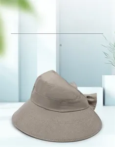 Detail view of khaki wide brim sun hat with texture and elegant back bow decoration