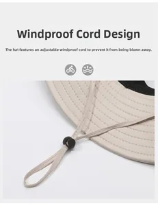 Detail of adjustable windproof drawstring with plastic toggle on beige sun hat