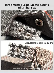 Detail of adjustable metal buckles on plaid wool beret for head size 55-59cm
