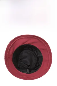 Detail of the inner breathable mesh lining and sweatband of the burgundy wool bucket hat