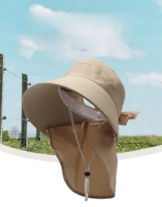 Detail of beige UV protection sun hat with wide brim and neck flap for outdoor coverage