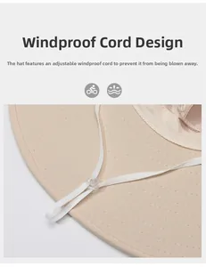 Detail of adjustable windproof strap with plastic buckle on a khaki sun hat