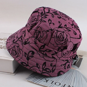 Floral print bucket hat for elderly women with pink black rose pattern on checked fabric