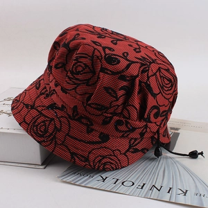 Detail of red floral print elder women's bucket hat with adjustable cord and texture