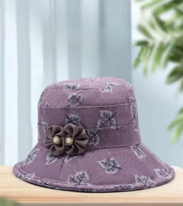 Nahaufnahme der lila Baumwoll-Sonnenhut mit weißen Blattmustern und Blumendekor
