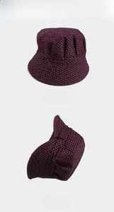 Detail of burgundy checkered sun hat showing breathable lining and adjustable inner strap