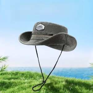 Close-up of army green cotton sun hat featuring adjustable chin strap and logo patch