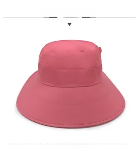 Detail of dark pink sun hat featuring lavender embroidery on breathable quick-dry fabric