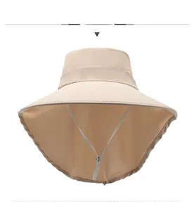 Detail view of wide brim sun hat with neck flap and adjustable chin strap in beige