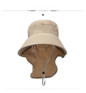 Detail view of khaki sun hat with wide brim, neck protector flap and adjustable drawstrings