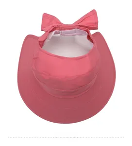 Top view of pink sun visor with oversized brim and sweatband detail