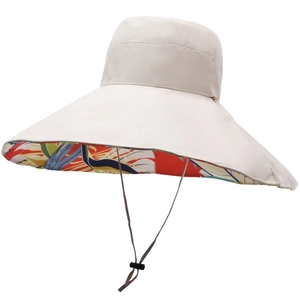 Beige wide-brim sun hat with colorful floral print lining and adjustable chin strap