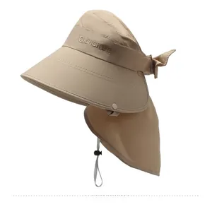 Detail of khaki sun hat featuring neck protection flap and adjustable chin strap cord