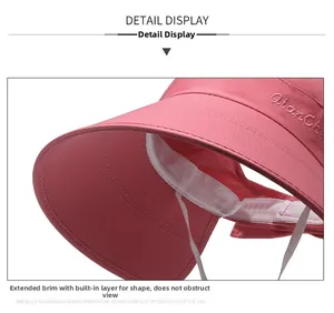 Detailed close-up of pink sun hat featuring long brim and firm structured texture