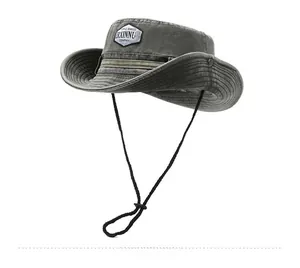 Detail of grey washed cotton outdoor sun hat with adjustable chin strap and fabric patch