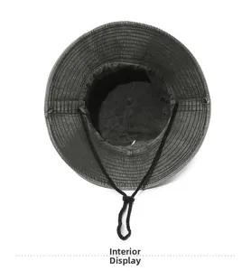 Interior view of washed cotton bucket hat showing fabric lining and adjustable windproof cord