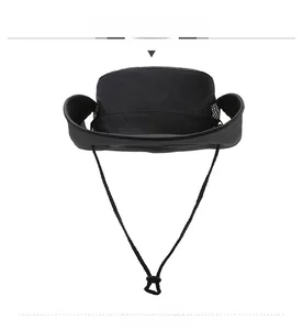 Detail view of the breathable mesh fabric and adjustable chin strap on the black sun hat