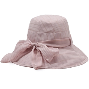 Pink women's sun hat with large bow and shimmering texture for outdoor summer protection