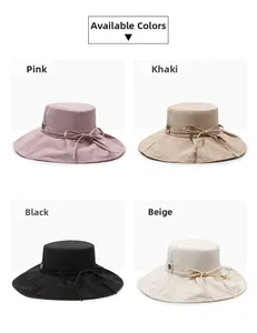 Detail showing foldable wide brim sun hats with bow decoration in four assorted colors