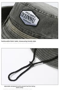 Detailed view of dark grey washed canvas sun hat with adjustable windproof cord and logo