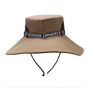 Detail of khaki sun hat featuring breathable black side mesh and decorative webbing strap