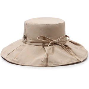 Breathable wide brim sun hat in beige with a bow detail for outdoor UV protection